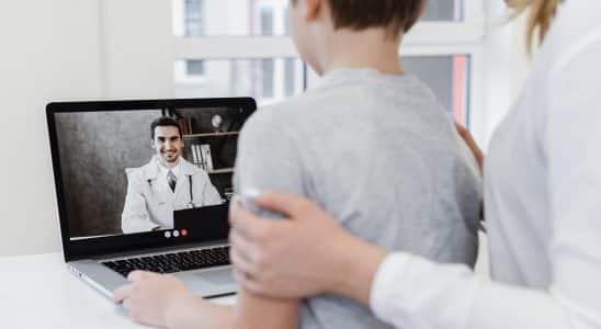 close up patient talking doctor online